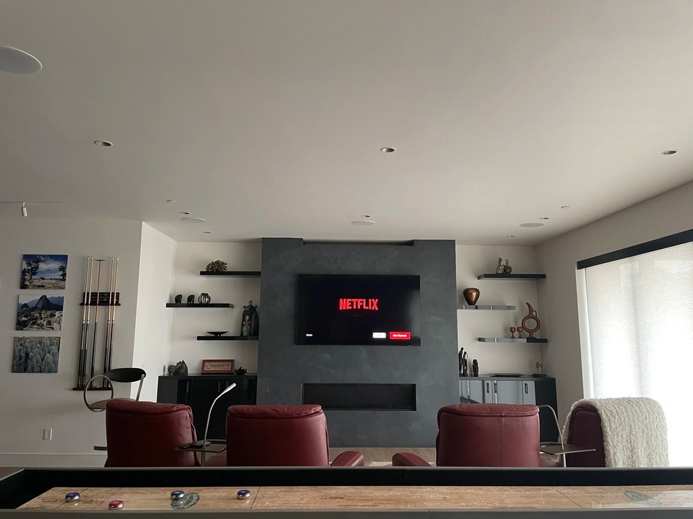 Media room with recessed lighting and motorized window shade, San Diego smart home installation