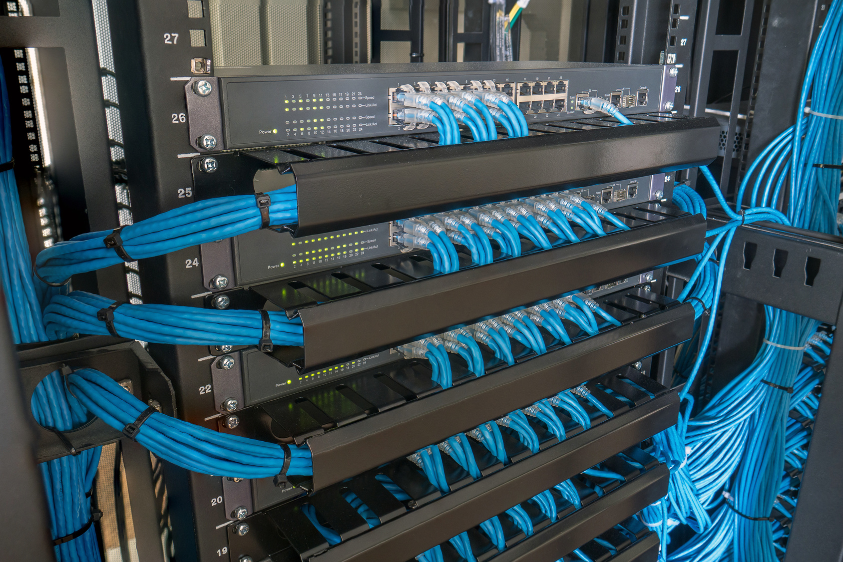 Network switch and ethernet cables in rack cabinet Network Switch And Ethernet Cables In Rack Cabinet